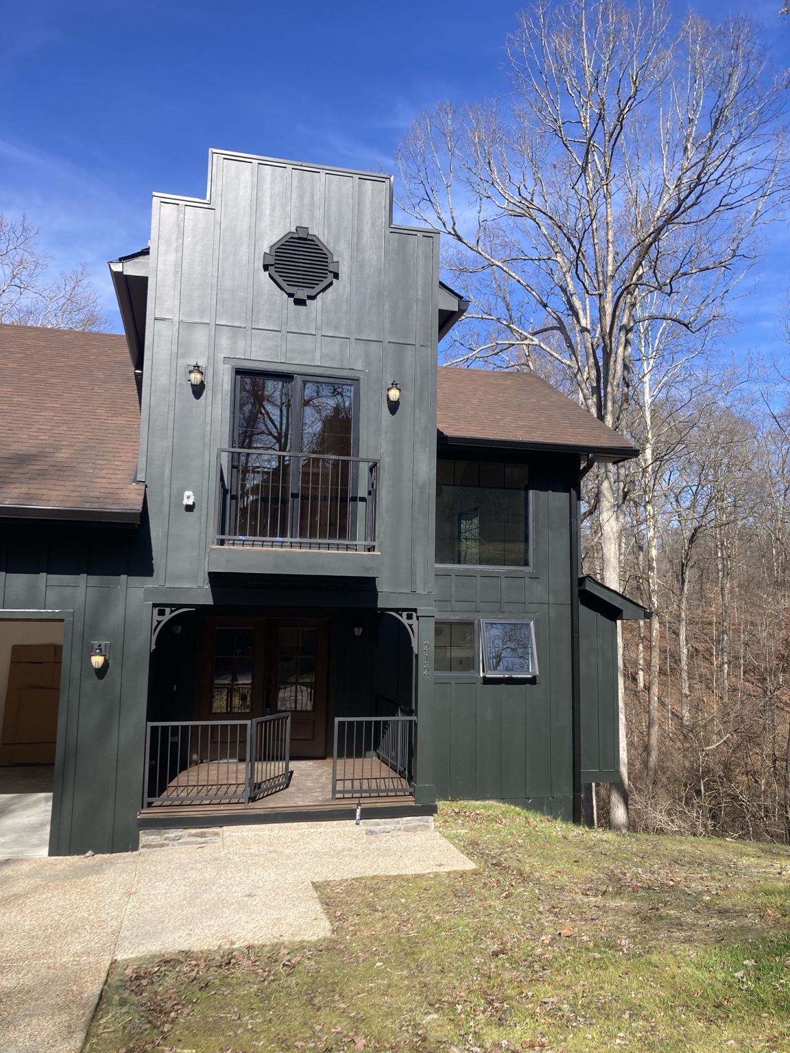 Dark modern custom home exterior on a project managed by James Chamberlin
